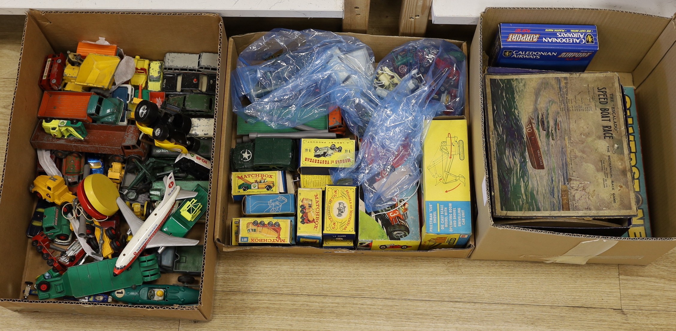 A collection of die-cast toys and boxed games